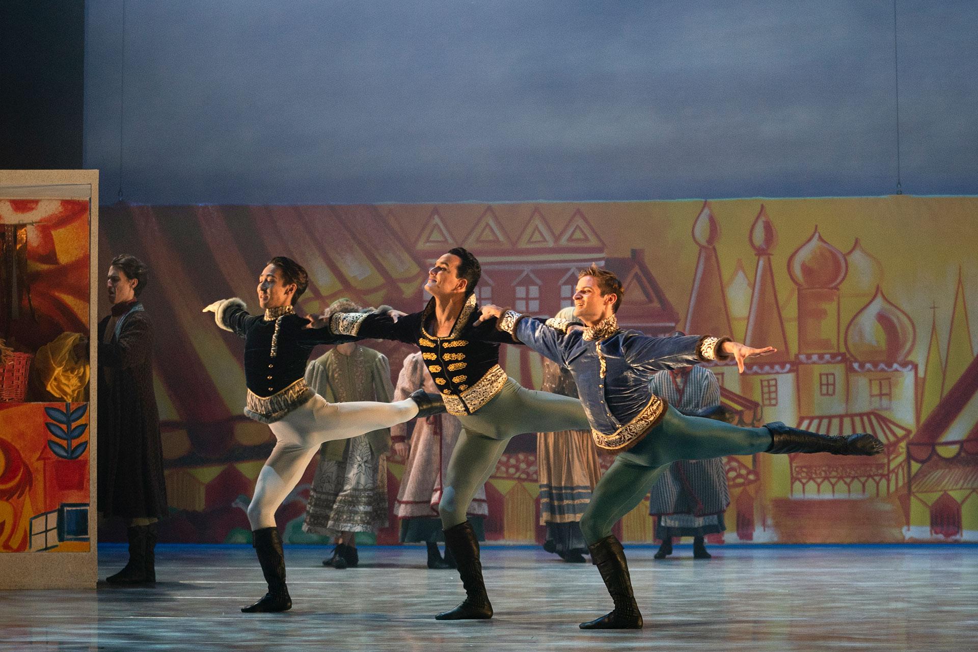 Northern Ballet dancers Riku Ito, Javier Torres and Nicola Gervasi dancing with joy in Cinderella. Photo Emma Kauldhar.