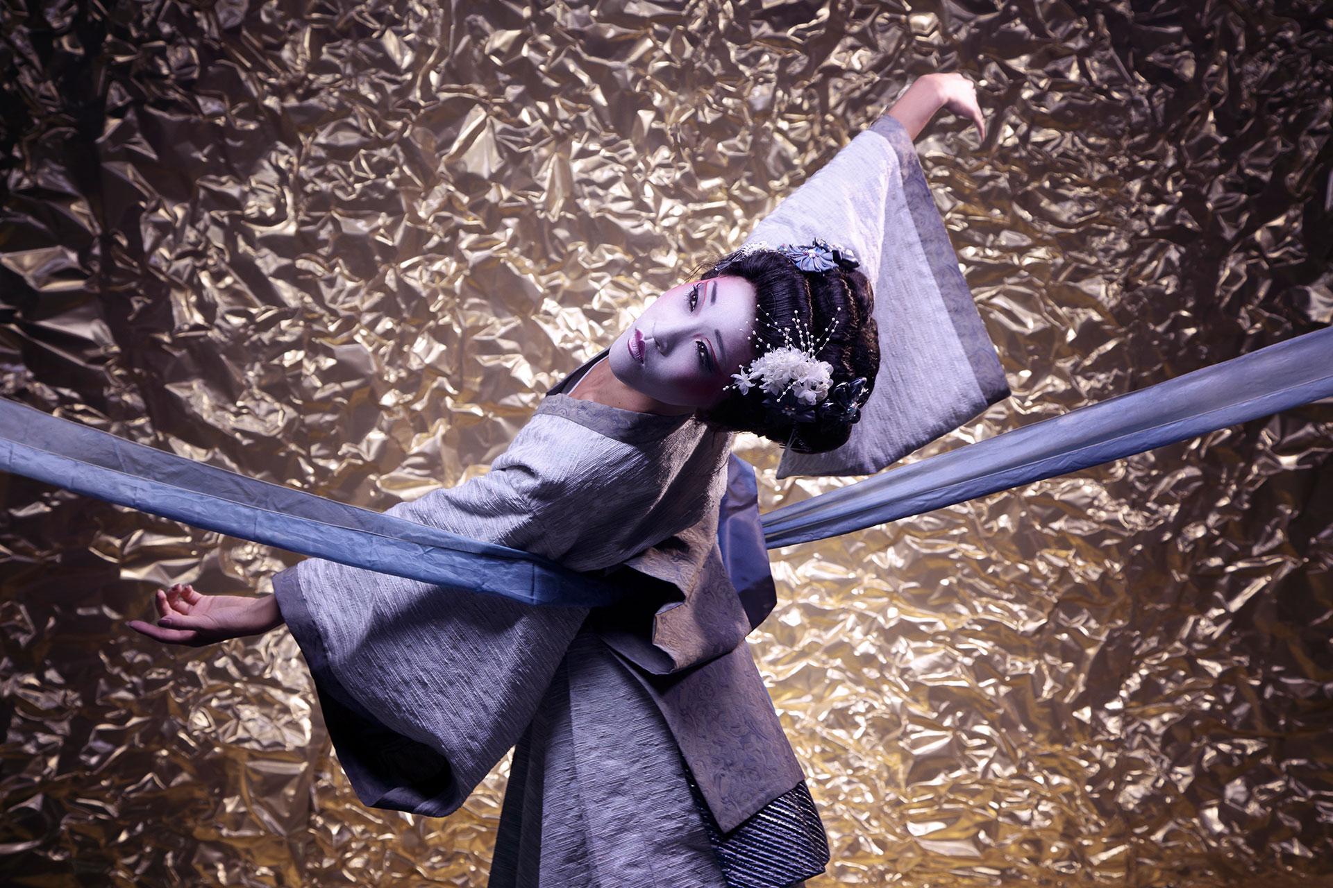 With the ribbon of her bustle stretched beyond the frame, Minju Kang's Geisha holds a stylised pose. Photo Guy Farrow.