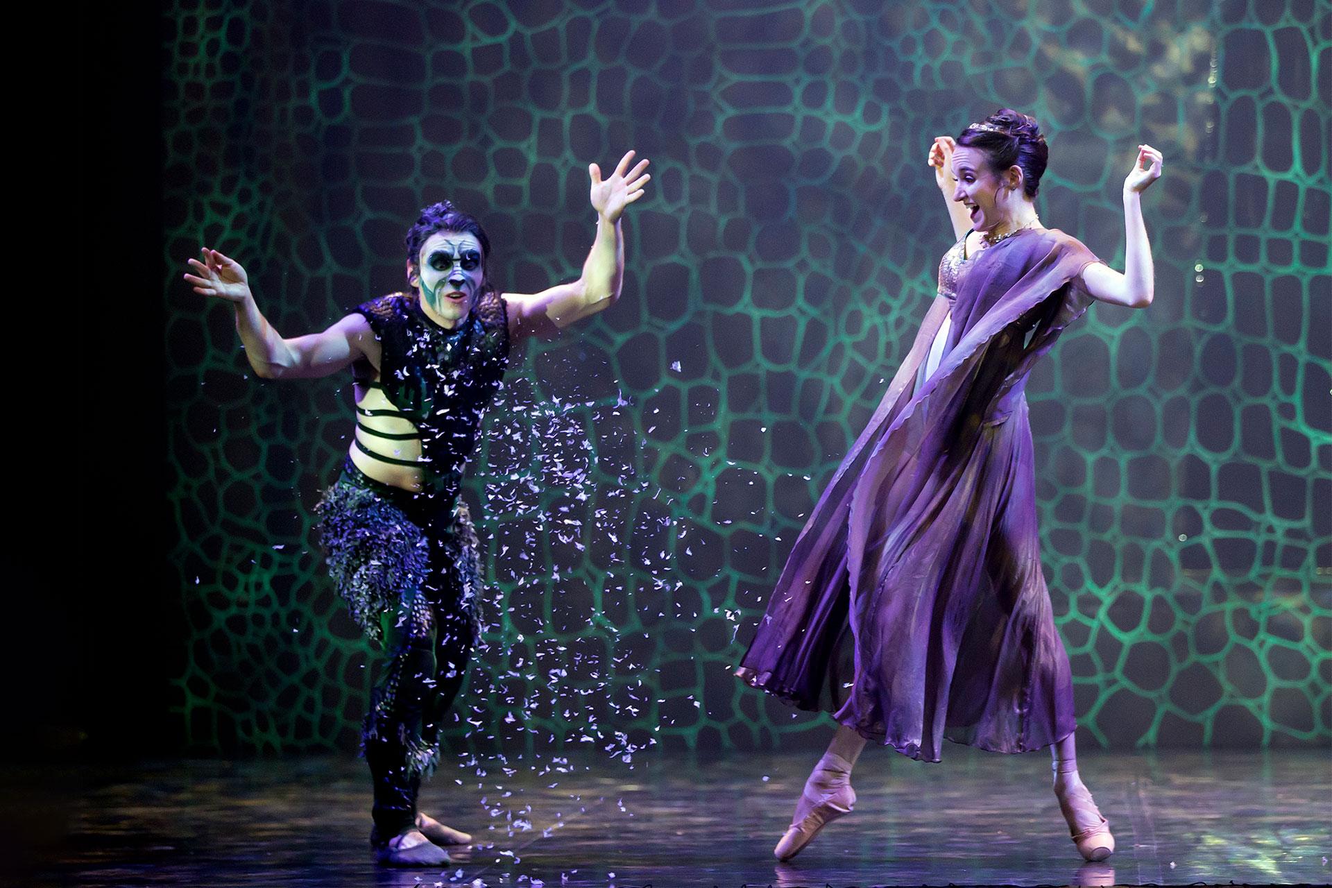 The Beast plays in the snow and Beauty joins in