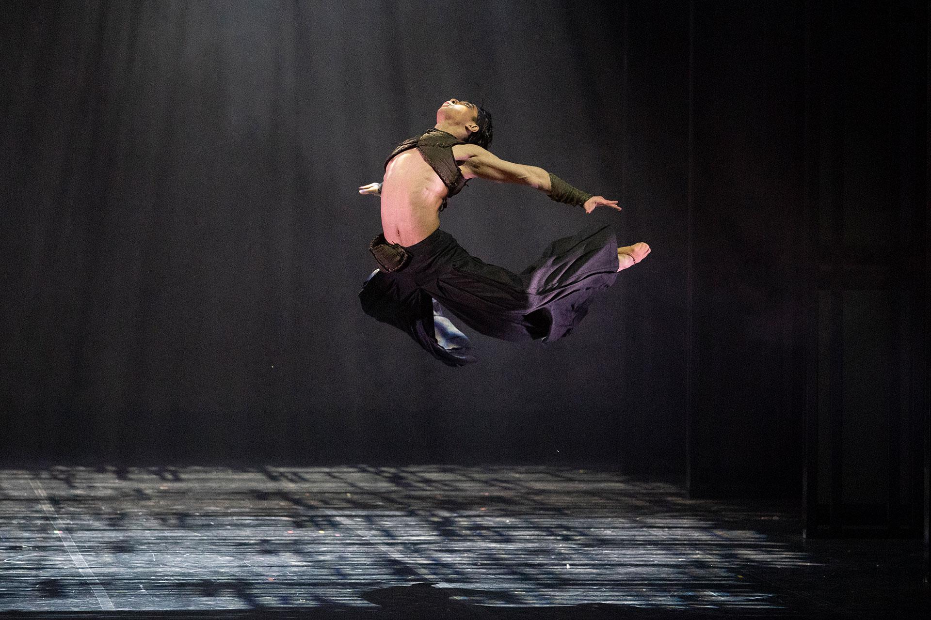 Takeda leaps high while stretching his limbs backwards