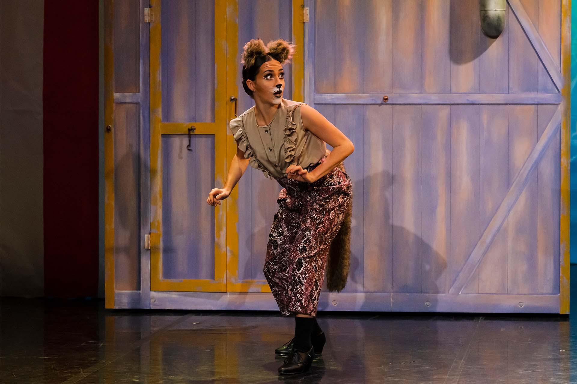 Camden the Cat stands furtively against the doors