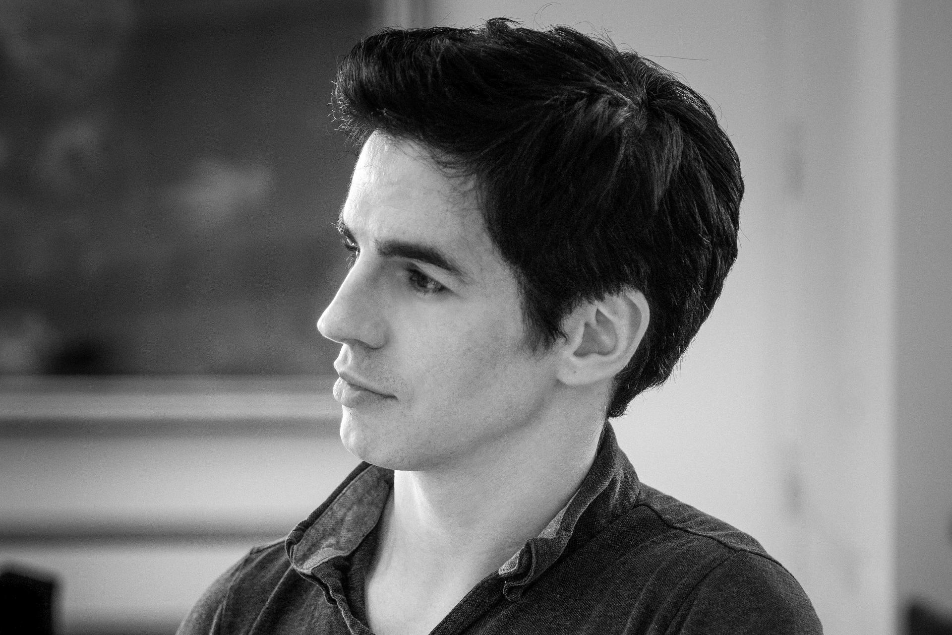 Black and white headshot of Federico Bonelli, looking away from the camera.