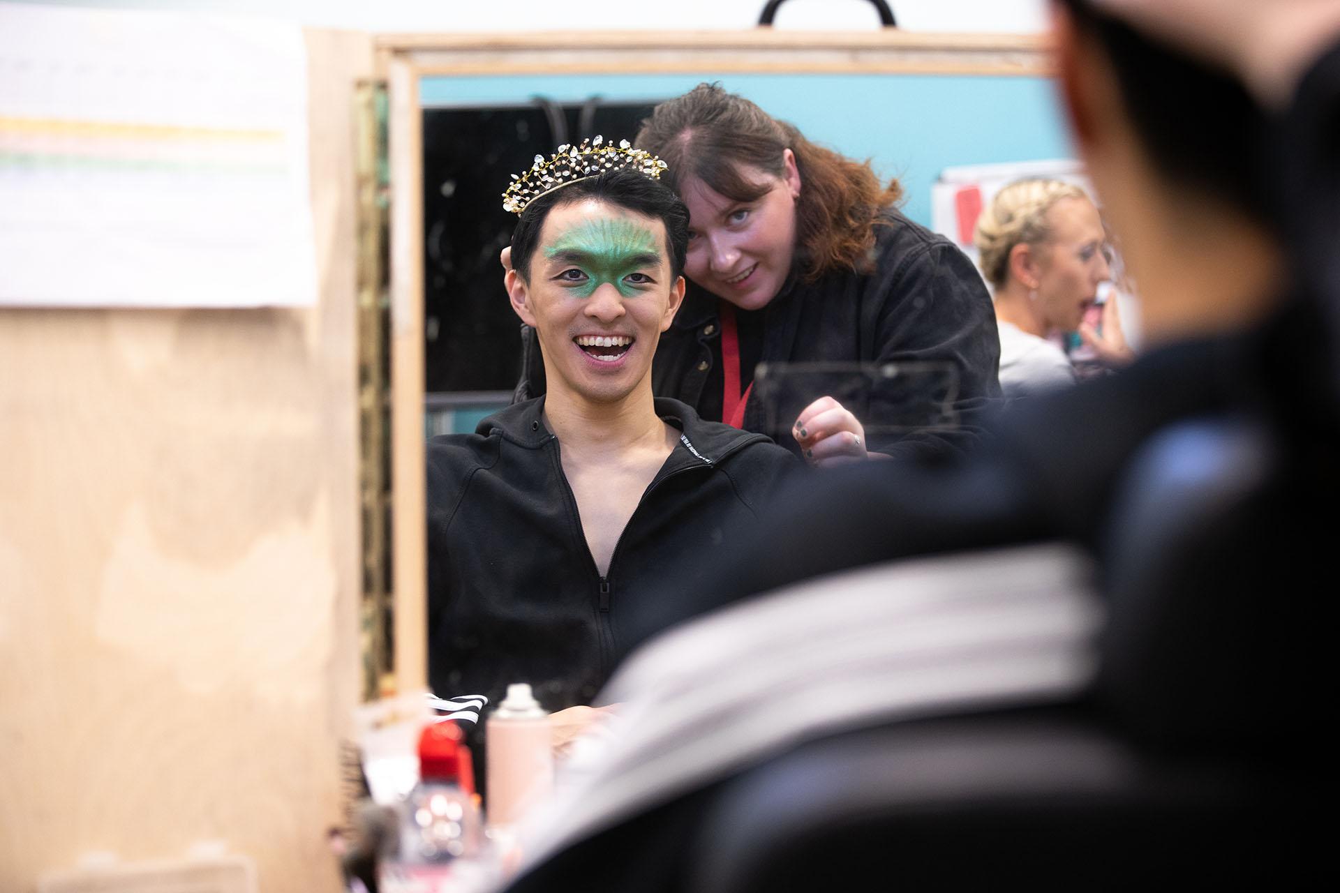 George smile as he gets ready in the make-up chair