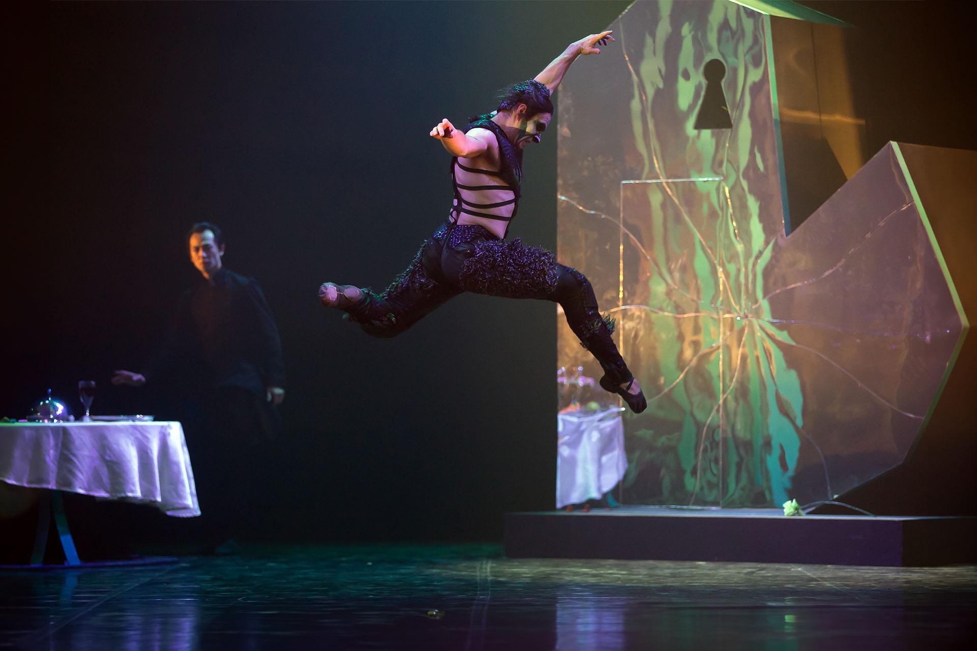 The Beast leaps high across the stage