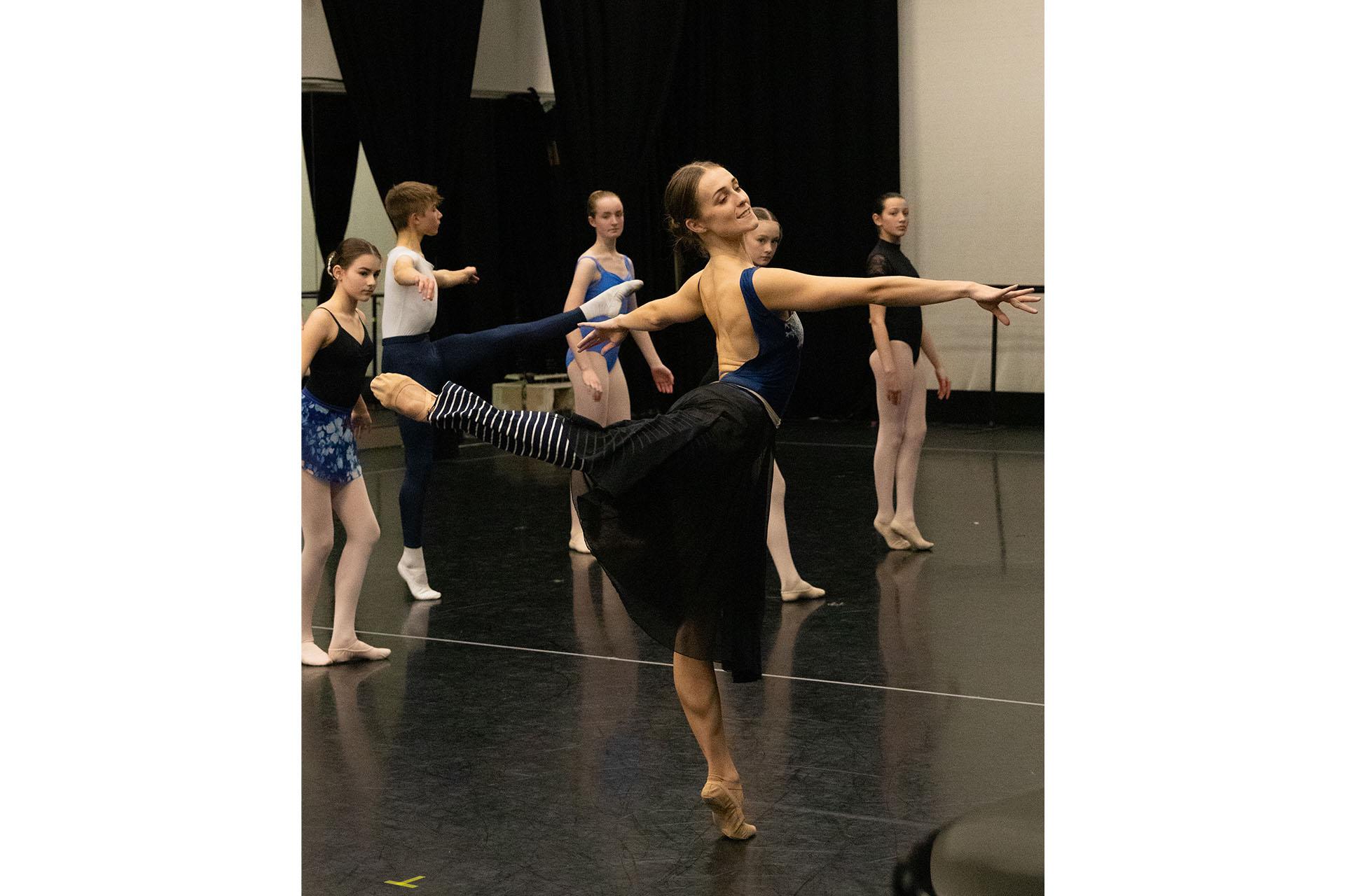 A dancer teaching a masterclass with students