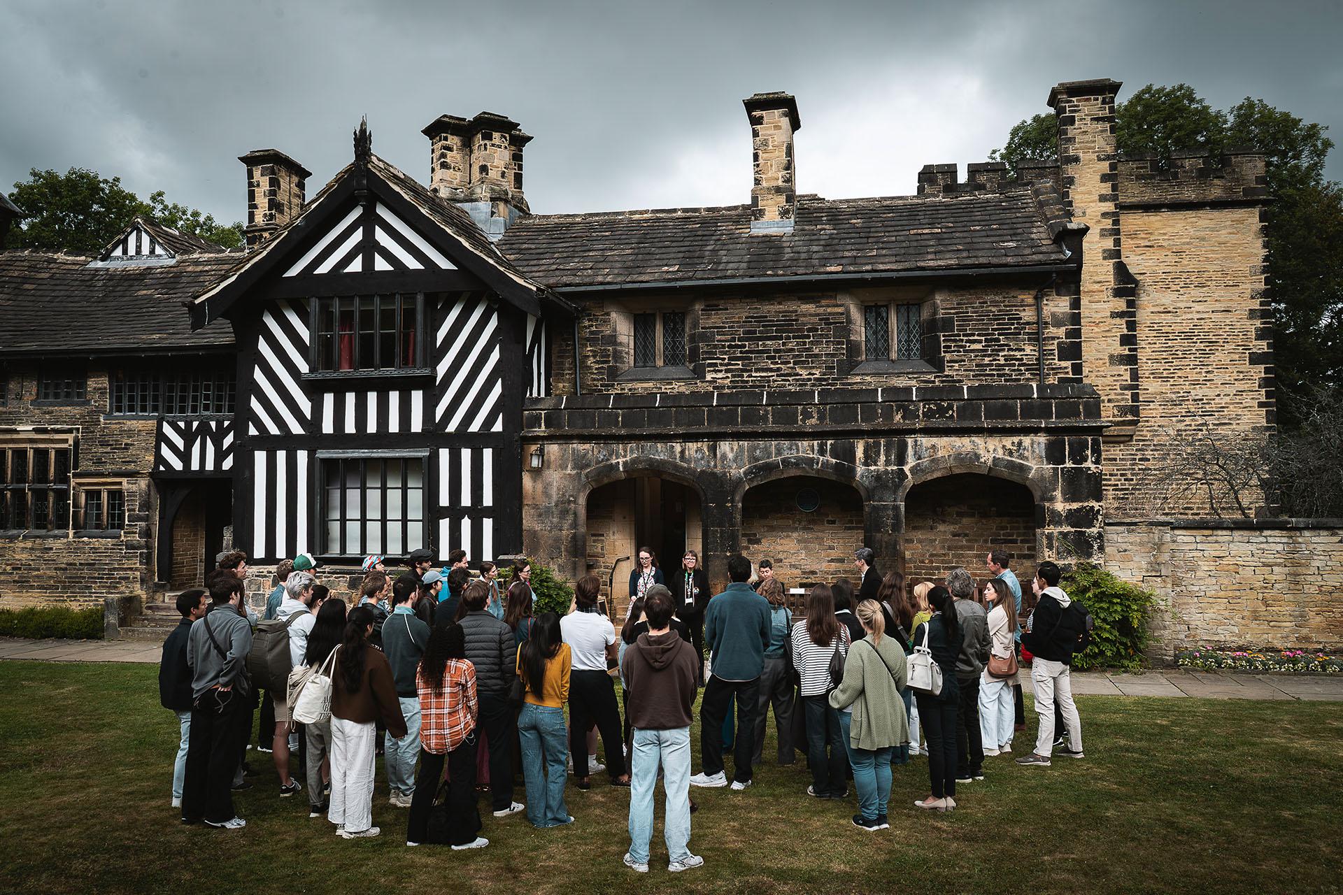 Northern Ballet dancers and Gentleman Jack creatives gathered outside Shibden Hall in Halifax learning about it and Anne Lister's history