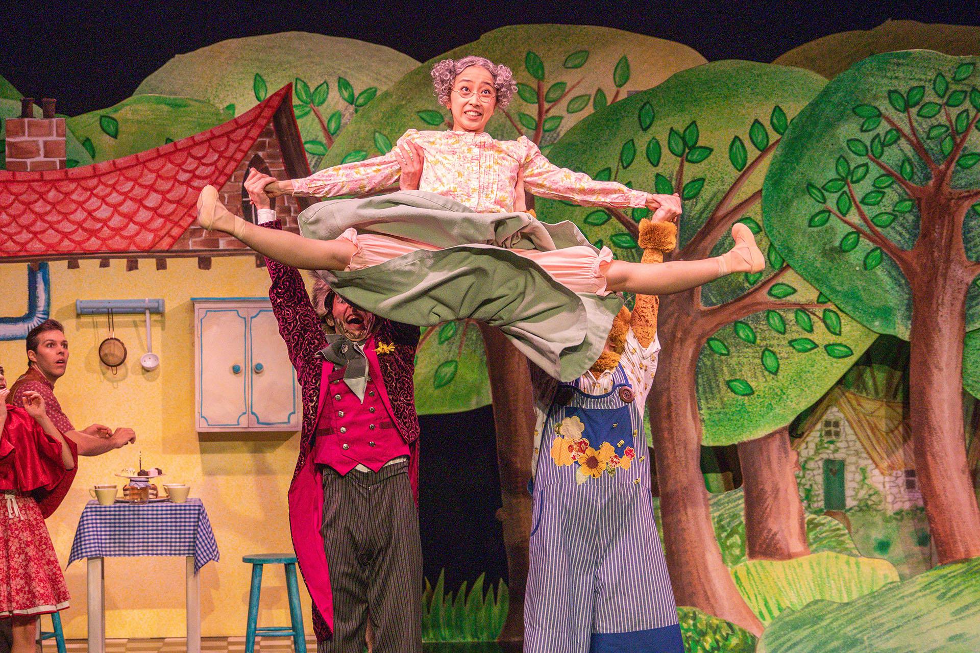 The Bear and the Wold lift Grandmother high, she splits her legs and smiles