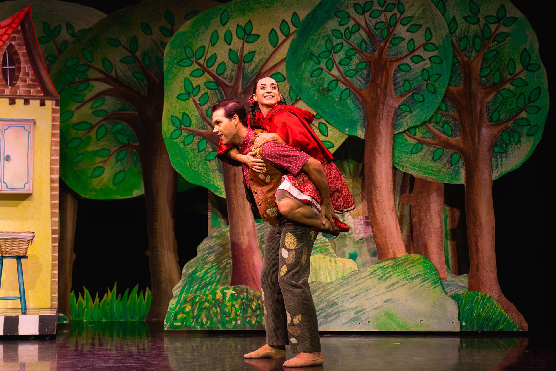 Little Red's father gives her a piggy back ride