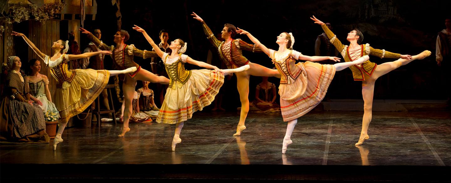 Dancers lined up in arabesque