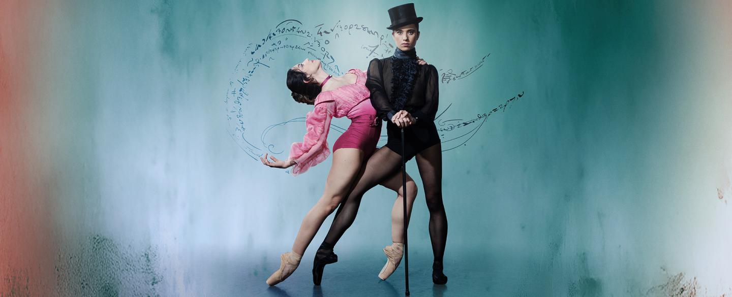 Wearing a black top hat and pointe shoes, the character of Gentleman Jack looks directly at the camera hands on a cane, a woman in pink hold onto her and leans back suggestively