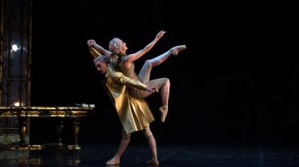 Casanova holds Henriette aloft on his back